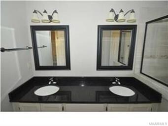 Master Bathroom features a double vanity with gran
