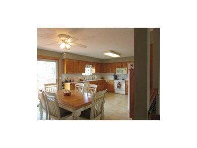 Spacious kitchen an eating area with sliding door 