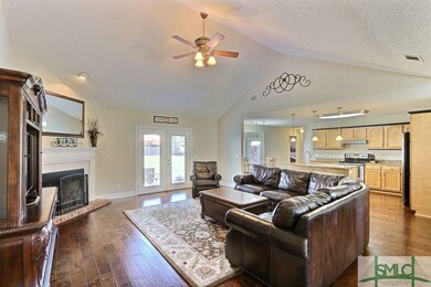 Family Room ~ Beautiful Wood Floors ~ Vaulted Ceiling