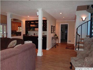 HOME FEATURES A SPIRAL STAIRCASE, AN OPEN MAIN LEV