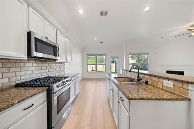 Beautiful granite countertops and stainless appliances including gas range/oven.