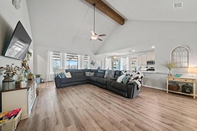 Living area with high vaulted ceiling, healthy am