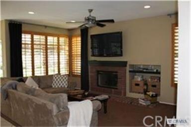 Relax in front of fireplace, family room has custo