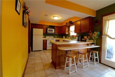 Breakfast bar provides additional seating and conv