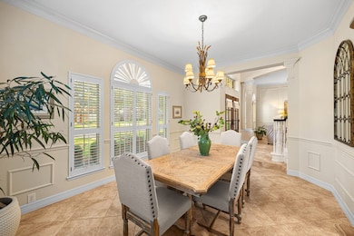 This inviting dining room features a stylish chand
