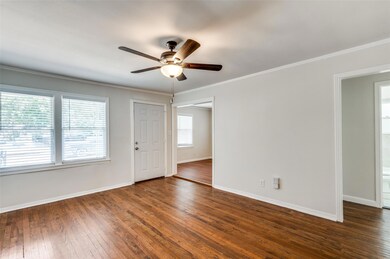 Spare room with dark wood-type flooring, ceiling f