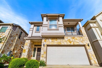 View of front of home featuring concrete driveway