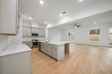 Open and bright, the kitchen opens up to the livin