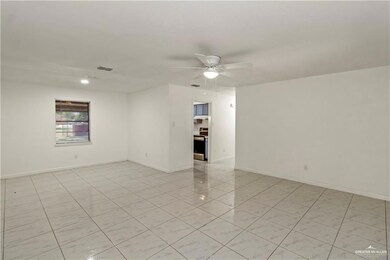 Empty room featuring ceiling fan
