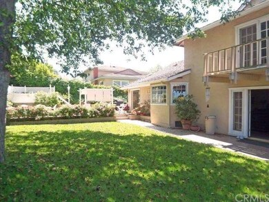 The French doors in the foreground lead to the Fam