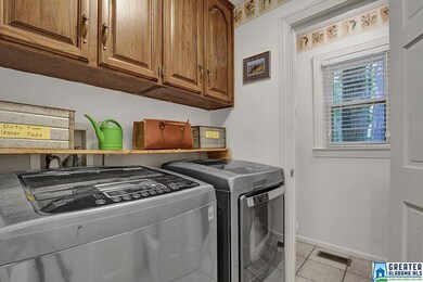 There is an entire spacious laundry room and walk 