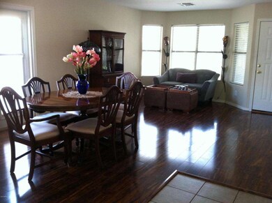 FORMAL DINING ROOM WITH LAMINATE FLOORIN