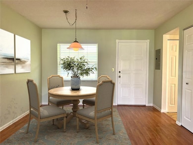 Virtually staged dining area shows you what is possible in this space.