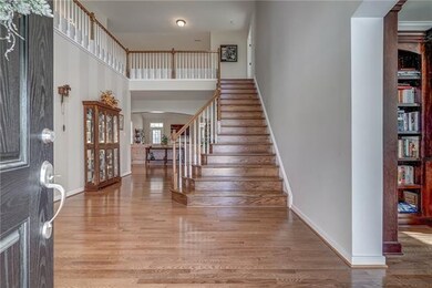 Grand sweeping foyer is inviting and open.