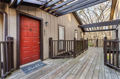 View of exterior entry with a wooden deck