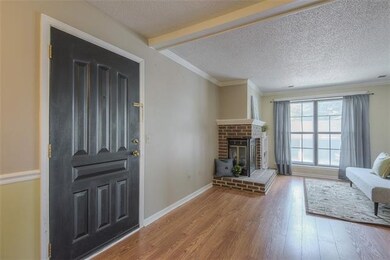Fabulous brick fireplace is focal point of living 