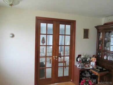 Living Room French pocket doors separate the livin