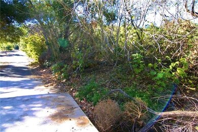A stream flows under this driveway entrance. 