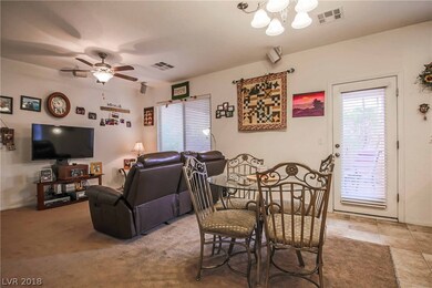 Great room features ceiling fan and surround sound
