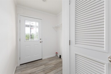 Laundry room and door to porch