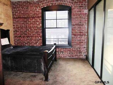 Brick walls, and a large custom wall-to-wall closet.  3 opaque sliding glass doors and an adjustable closet system allow for maximum use of space.