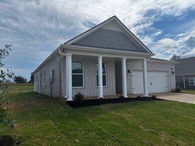 View of front facade with a garage and a front yar
