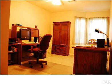 One of the Additional Bedrooms that is being used as an office. This room has an extra deep closet, giving space to utilize the higher shelving.