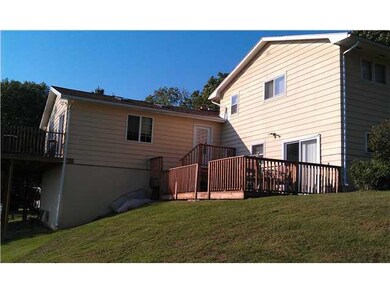 Exterior Back. Deck w/sliding glass doors to finis