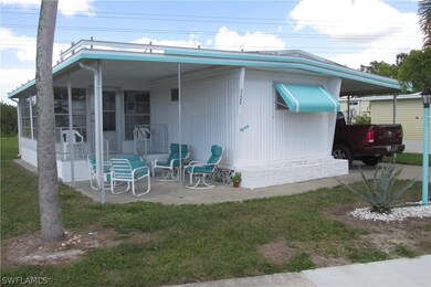 Side view, porch and patio.