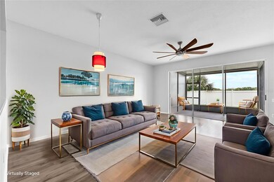 The family room/kitchen is the heart of the home and features high ceilings, plenty of room for furniture, with a sliding glass door leading to a covered/screened lanai perfect for enjoying the great Florida weather and entertaining.