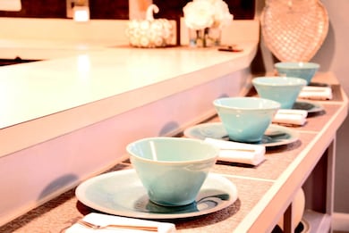 Wake up to your coffee in this toasty refreshing kitchen and sit at the counter with your family nearby.