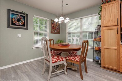 Eating area off the kitchen. New paint and luxury vinyl plank flooring.