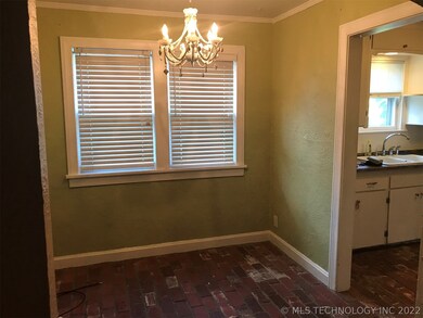 brick floors leading into kitchen