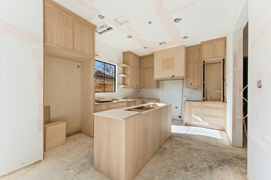 Kitchen offers custom inset white oak cabinetry an