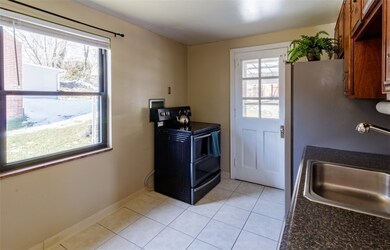 Kitchen with ceramic tile flooring and stainless s