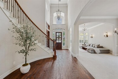 Foyer entrance featuring stairway, an inviting cha