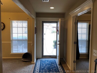 Entryway w/ office on the right and formal dining