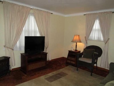 Living Room. Cove ceilings.  HW floors under carpe