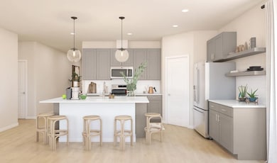 Kitchen with pendant lighting and floating shelves