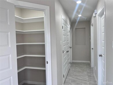 Hallway featuring visible vents, baseboards, recessed lighting, and marble finish floor