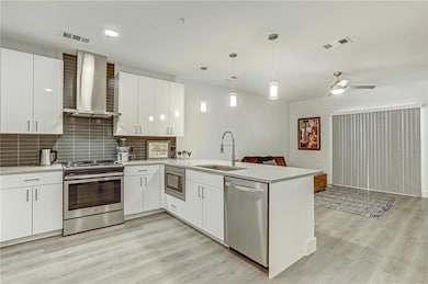Kitchen featuring appliances with stainless steel