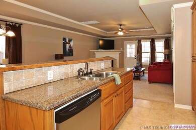 ANOTHER VIEW OF THE KITCHEN ISLAND OPEN TO THE LIV
