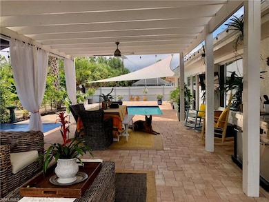Fenced backyard with outdoor dining space and a patio area