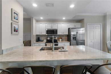 Kitchen with a breakfast bar area, ornamental mold