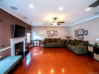 Large family room with gas fireplace and surround 