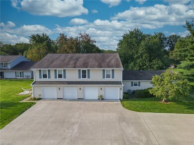 View of front of home with garage and a front lawn