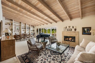 Amazing living room & dining area with open beam ceiling.