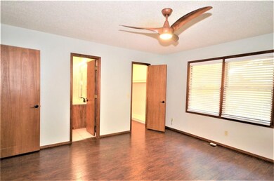 The large master bedroom features a walk-in closet.