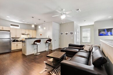 Living room with dark wood-style flooring, recess
