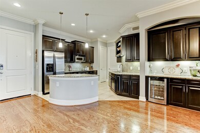 Located by the kitchen is a dry bar that features